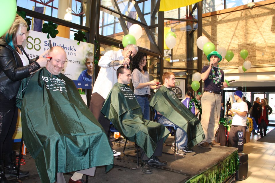 Three shavees donating to the St. Baldrick's foundation. Over $15,000 was donated so far. Photo by Cody Heintz.