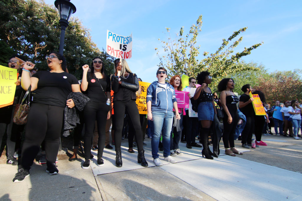 Students protest outside of CV Starr Hall. (Photo by Cam Keough/The Chronicle)