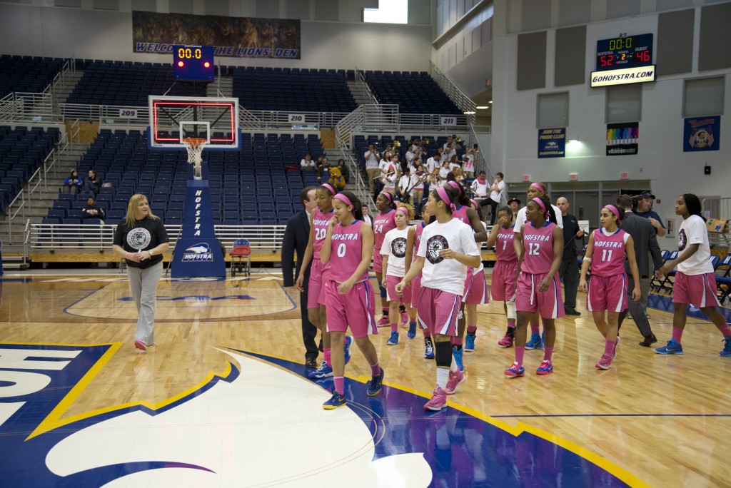 Alex Mitchell/The Chronicle The women's basketball team celebrates a win in front of a lacking crowd at the Mack.