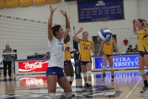 Amanda Benizzi/ Hofstra Chronicle Corrina Delgadillo and Hannah Klemm celebrate after notching a key point in their win over UNC-Wilmington.