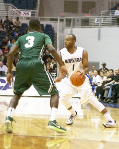 Megan McGuire/The Chronicle Juanya Green cuts back to the right, away from a Jacksonville defender last season. Green wants to see more Hofstra students come out to games.