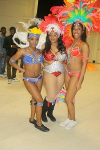 Three of the Bacchanal girls displaying their costumes