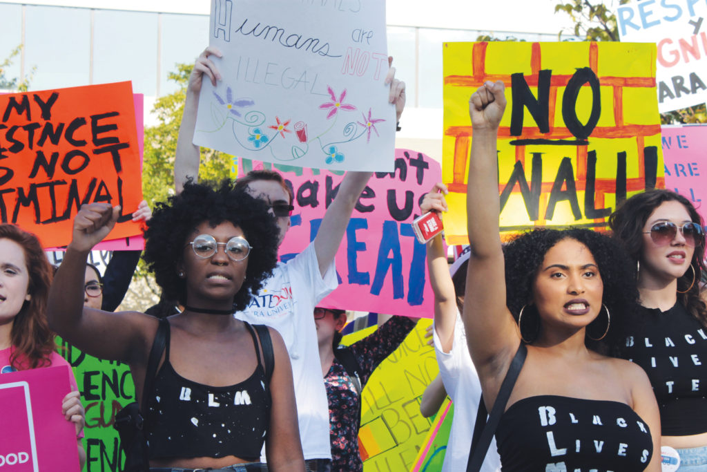 Students stand in solidarity protesting social issues. (Photo by Hayley Pudney/The Chronicle)