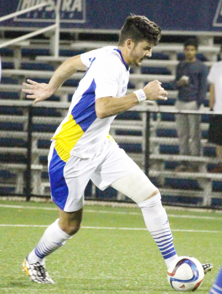 Cam Keough/The Chronicle -  Harri Hawkins sets his feet before taking the game-winning shot in overtime.