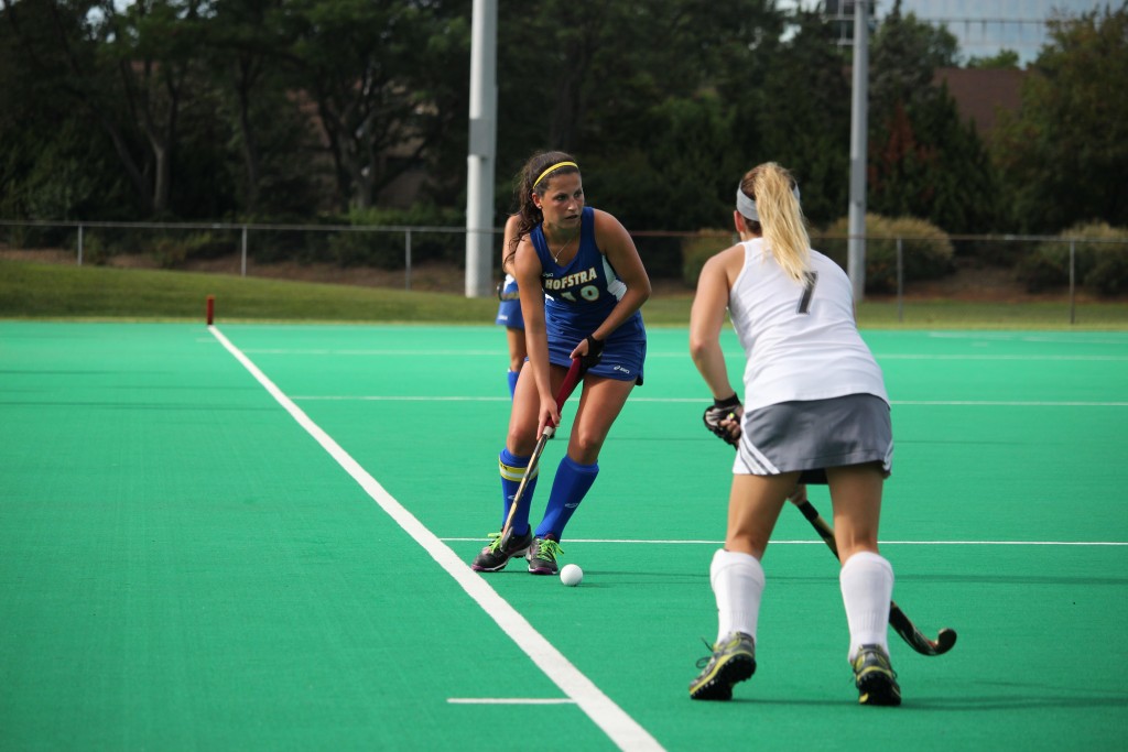 Cam Keough/The Chronicle Charlottle Loehr scans the turf at Hofstra Field Hockey Stadium. She scored in the win.