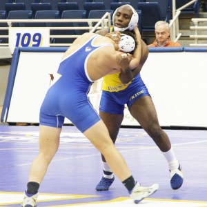 Victoria Mickens/The Chronicle Jermaine John grapples with a teammate in an exhibition bout during Fridays Hofstra Wrestle-Offs at the Mack Center.