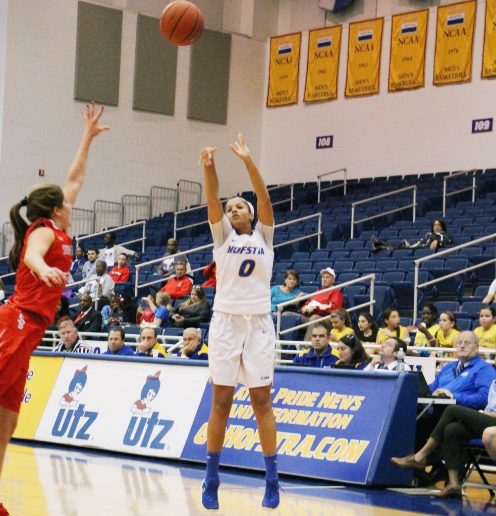 Cam Keough/The Chronicle Kelly Loftus shoots from outside the arc. She tallied 26 points, making 6-of-10 three-pointers. 