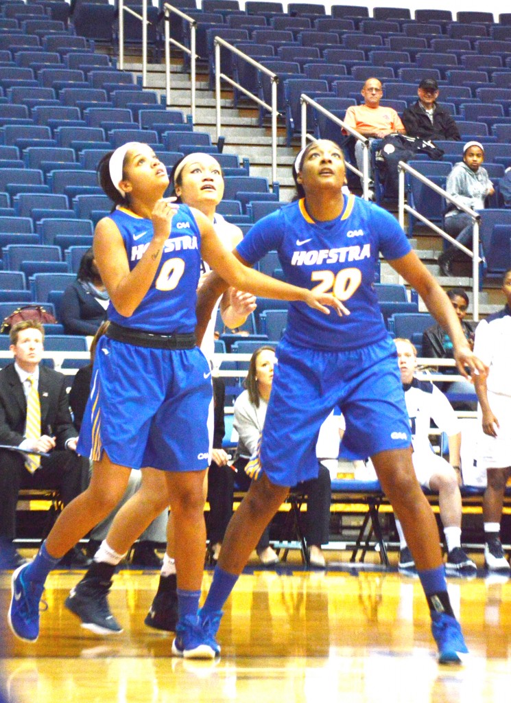 Jesse Saunders/The Chronicle Jesse Saunders/The Chronicle Anjie White (20) and Kelly Loftus (0) fight for a board against Navy on Friday. 