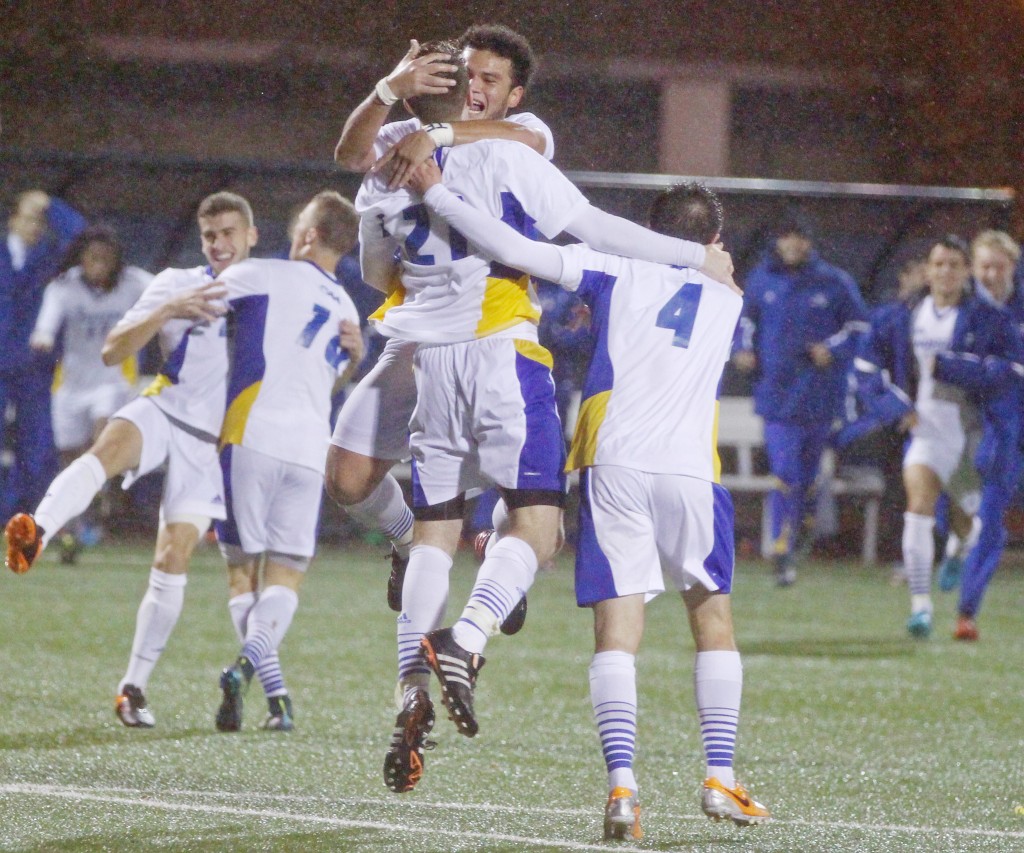 Cam Keough/The Chronicle After Daniel Massey (21) scored the game-winning goal, Mario Ruiz and Jon Frazier (4) come together and celebrate their team's victory.