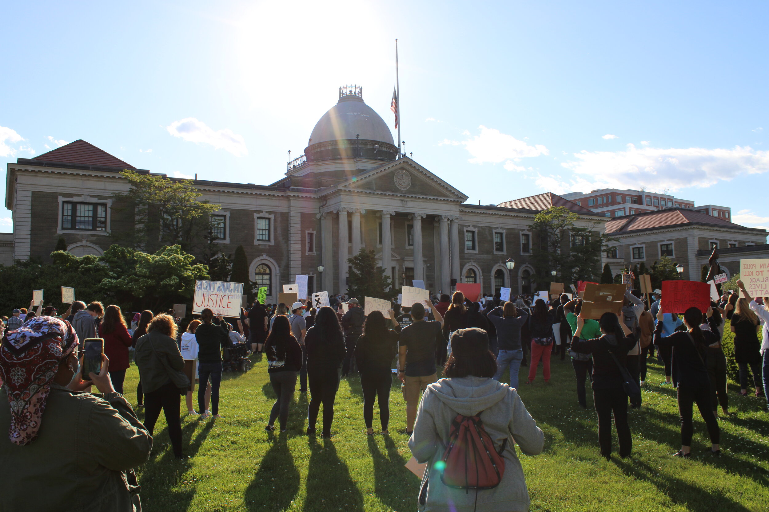  Protestors gathered outside the Nassau County Legislature in Mineola, New York.  Photo by: Brandon Allen  