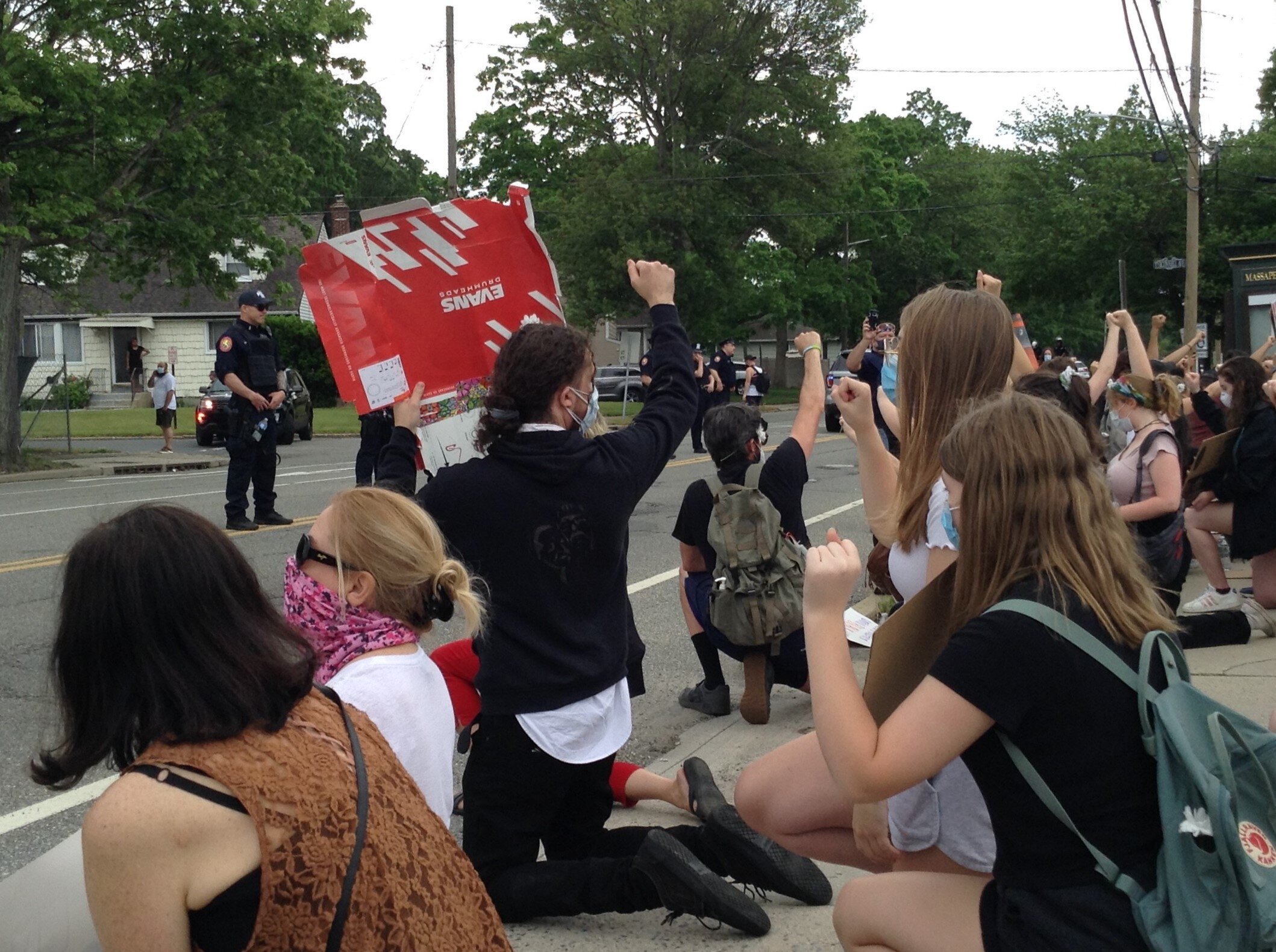  Protestors in Massapequa, New York on Thursday, June 4, 2020, took a knee and held their fists up in a display of solidarity.  Photo by: Nathan Odige  