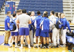 Victoria Mickens/The Chronicle Coach Dennis Papadatos speaks to his team after Fridays Wrestle-Offs. The team opens up the season next Sunday.