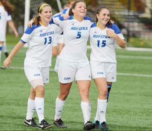 Cam Keough/The Chronicle Jeannine Molleda (13) and Mallory Ulrich (15) stroll off with Jill Mulholland (5). Mulholland is tied for team second in points with 15, including seven goals.