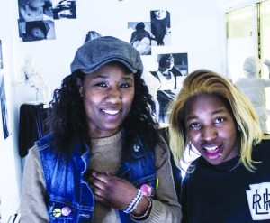 Nailah Fuller and Kay Hopkins are thrilled with the gallery after pulling an all-nighter to open on time. Photo by Sam Branch.