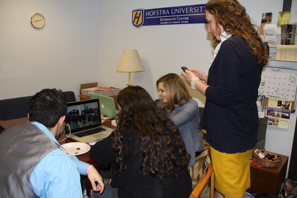 Hofstra Newman Club members watch black smoke emerge from the Vatican on Wednesday afternoon, signaling the choice of Cardinal Jorge Mario Bergoglio of Argentina as the next pope. Photo by Cody Heintz.